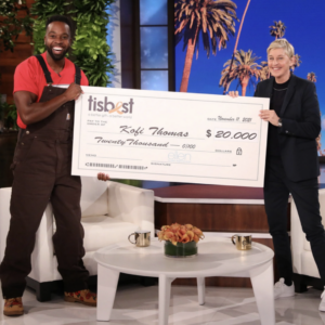 Founder of Good Life Garden Kofi Thomas receives a TisBest check on The Ellen DeGeneres Show.