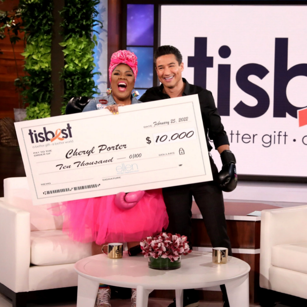 Cheryl Porter of The Cheryl Porter Method receives a TisBest check on The Ellen DeGeneres Show.