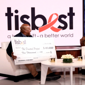 Sheldon Smith, founder of The Dovetail Project, receives a TisBest Check on The Ellen DeGeneres Show.