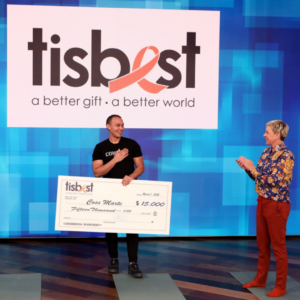 Coss Marte of ConBody receives a TisBest check on The Ellen DeGeneres Show.