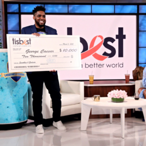 George Caesar receives a TisBest check on The Ellen DeGeneres Show.