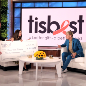Mila Kunis and Ashton Kutcher receive a TisBest chek on The Ellen DeGeneres Show.