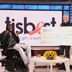 Emeka Nnaka receives a TisBest check on The Ellen DeGeneres Show.