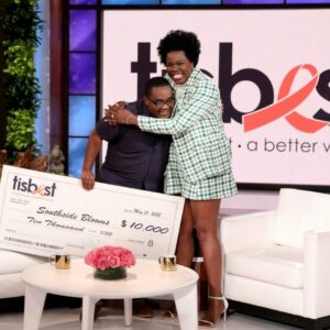 Quilen Blackwell of Southside Blooms receives a TisBest check on The Ellen DeGeneres Show. 